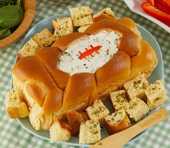 hand braided brioche bread bowl stuffed with French onion dip for game day | bakerly