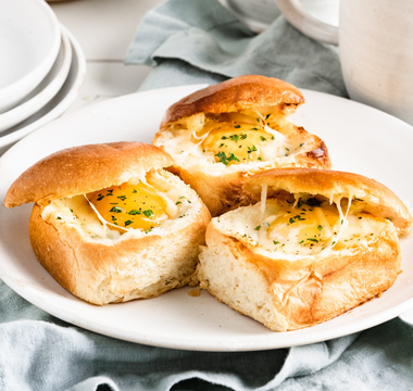 over-easy egg in brioche dinner rolls | bakerly