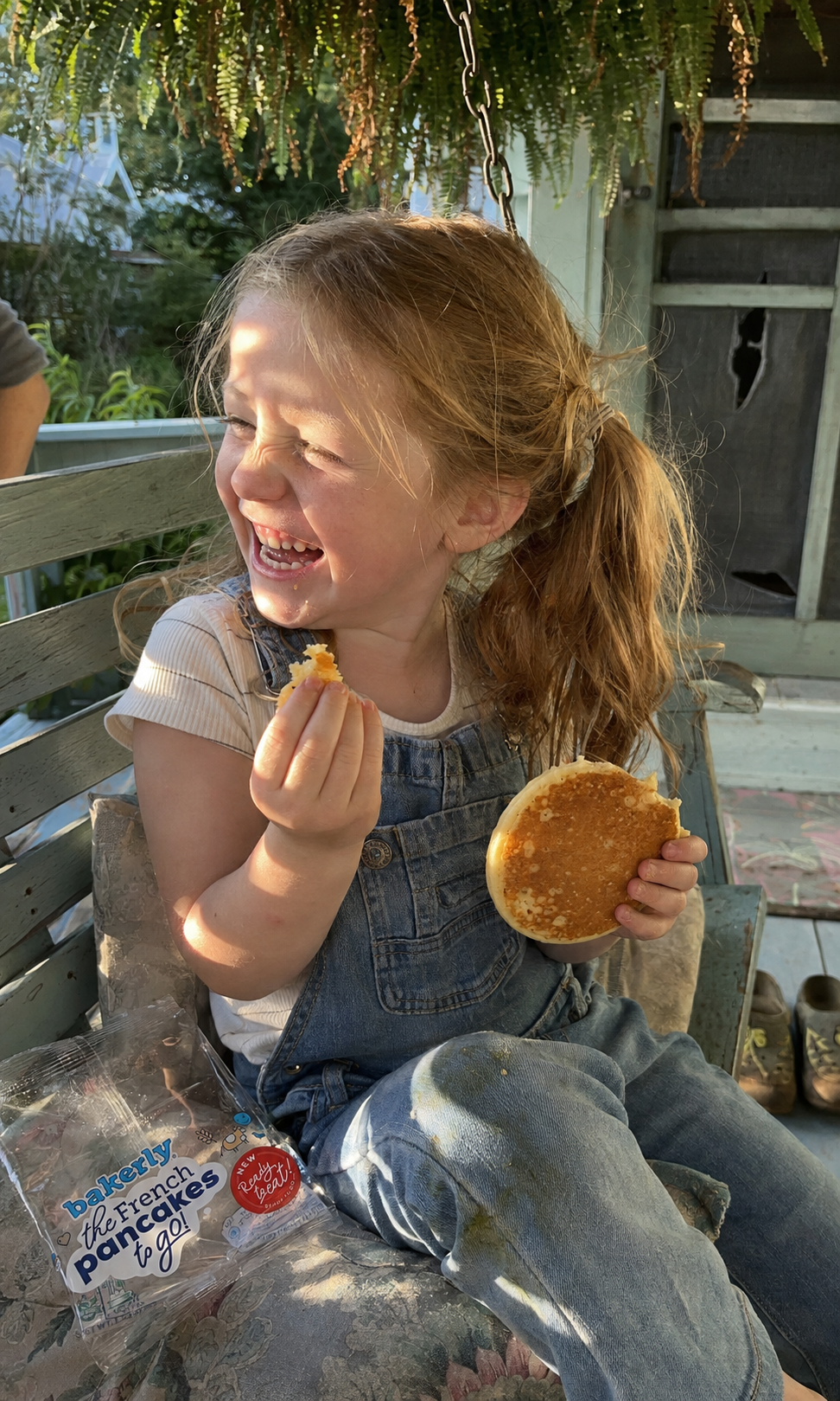 Girl enjoying a bakerly French pancake during a backyard snack break